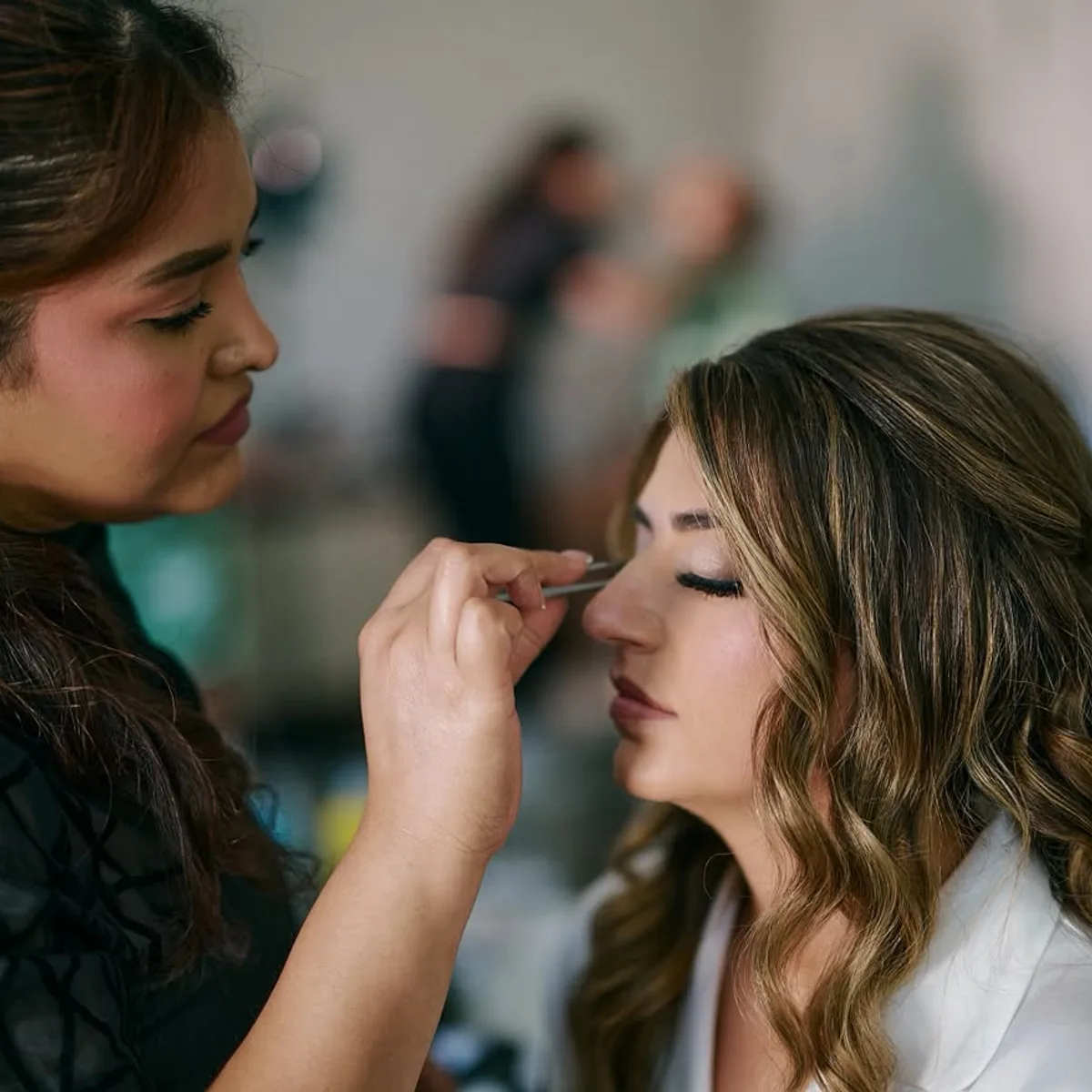 Eunice lining a bride's eyes on the wedding morning